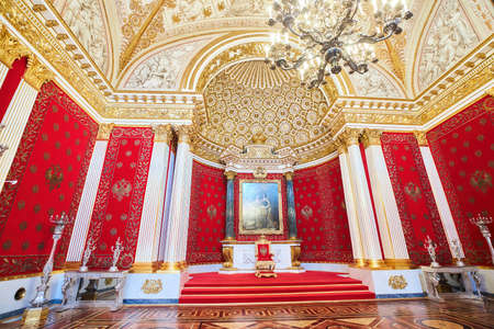 St. Petersburg, Russia - May 27, 2021: Hermitage Museum, Throne Room of the Palace. A red throne on a pedestal. Chic palace interior details.のeditorial素材