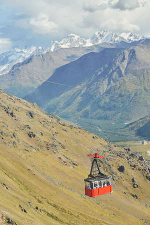Attraction cable car for climbing the mountain. Travel and tourism to the mountains, forest, high...
