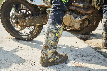 Motorsport, motorcycle wheel in the mud. Mountain motorcycling. Adventures on the trackの写真素材