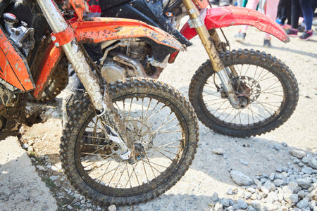 Motorsport, motorcycle wheel in the mud. Mountain motorcycling. Adventures on the track
