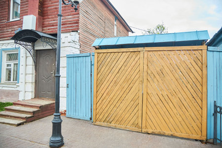 Vladimir, Russia - May 08, 2022: An old gate in one of the city housesのeditorial素材