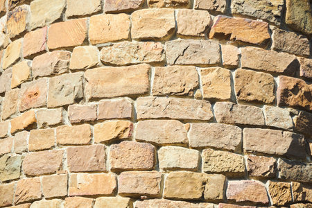 Background texture of a stone wall photo. Natural stone wall texture for the background. Old brick...
