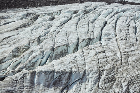 Dirty snow that hasn't melted yet. Spring and the arrival of heat.の写真素材