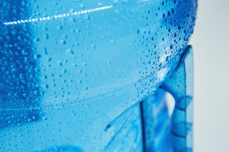 Water drops on the surface of a plastic bottle. The concept of clean ecological drinking water.の写真素材