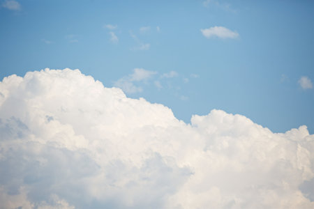 Bright blue sky with clouds. A clear day.