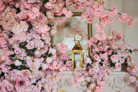 A detail of a romantic interior decorated with flowers.