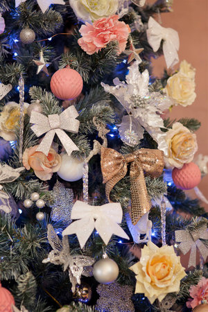 Elegant decorated with balls, flowers and figures Christmas tree with a beautiful design.