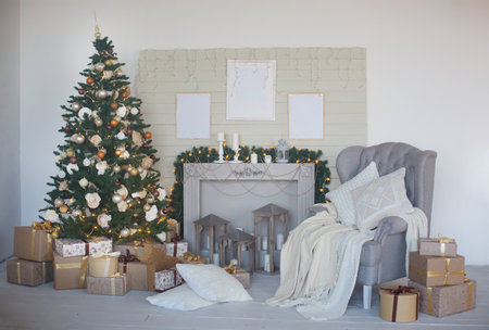 Room decorated for Christmas or new year. The interior of the room with a Christmas tree and decorations for the holiday.の写真素材