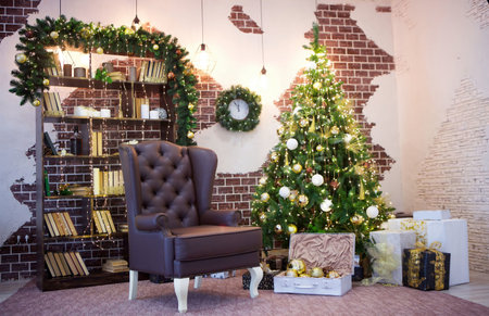 Room decorated for Christmas or new year. The interior of the room with a Christmas tree and decorations for the holiday.の写真素材