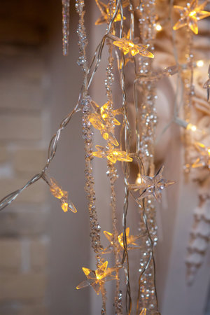 New Year and Christmas decoration at home. Glowing garland for the holidayの写真素材