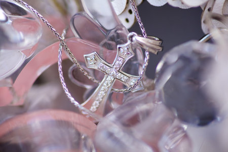 Christian cross to wear on the body after baptism. Material-silver. The concept of faith and religion.の写真素材