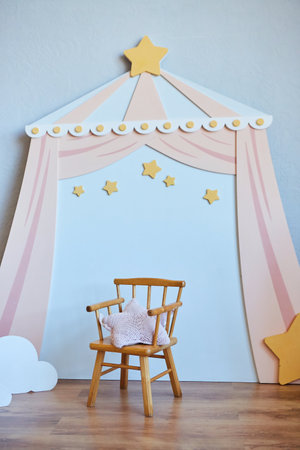 The decor of the children's room in the loft style. A play area with a high chair. A room for an infant or a younger child.の写真素材