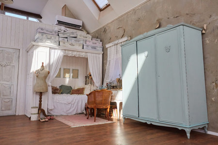 Bedroom in Provence style. An old bed and interior details in white tones. Vintage interior.の写真素材