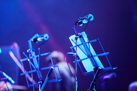 Music stands on stage in a symphony orchestra. Sheet music for a musician. The concept of culture and art.の写真素材