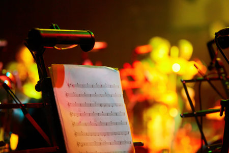 Music stands on stage in a symphony orchestra. Sheet music for a musician. The concept of culture and art.の写真素材