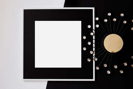 White picture frame with decorations. Mock up for your photo or text. Place your work, print art, white background, pastel color book. Photo realistic 3d illustration. Black and white backgroundの写真素材