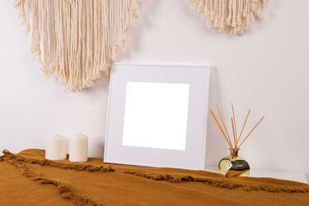 Gold picture frame with decorations. Mock up for your photo or text. Place your work, print art, white background, pastel color book. Photo realistic 3d illustrationの写真素材