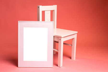 White picture frame with decorations. Mock up for your photo or text. Place your work, print art, white background, pastel color book. Photo realistic 3d illustrationの写真素材