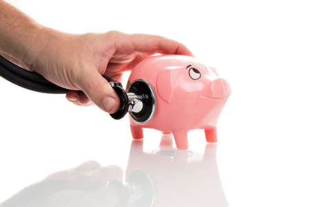 Pink Money Pigg with stethoscopeの写真素材