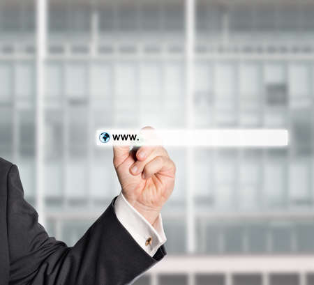 businessman touching web browser address bar with www signの写真素材