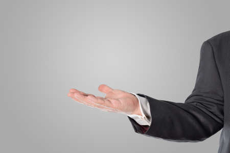 Salesman, businessman presented a symbol in his handの写真素材