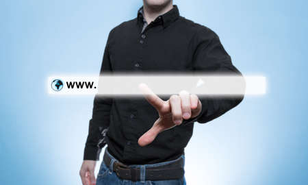 Young businessman touching web browser address bar with www signの写真素材