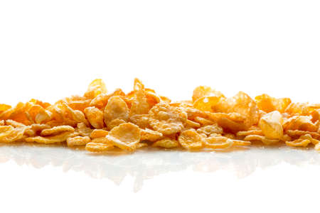 A lot of corn flakes on white ground