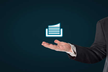 Businessman holding a virtual document symbol in his handの写真素材