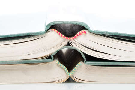 Many pitched books are placed in a stackの写真素材