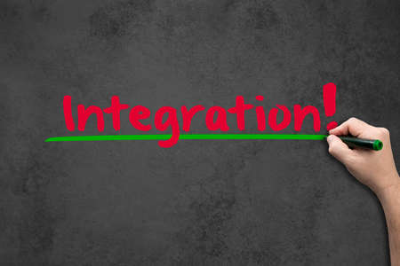 Man writes the word integration on the wallの写真素材