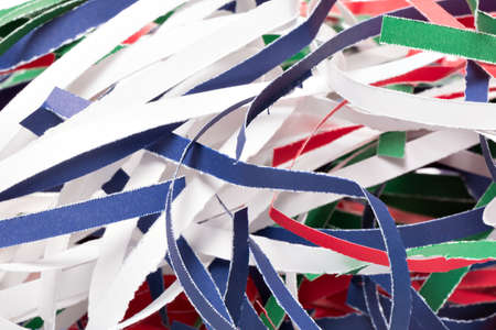 Colorful shredded paper stripes with white backgroundの写真素材