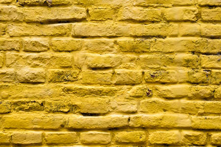 Yellow brick wall, background with structures and Copy Space for the designの写真素材
