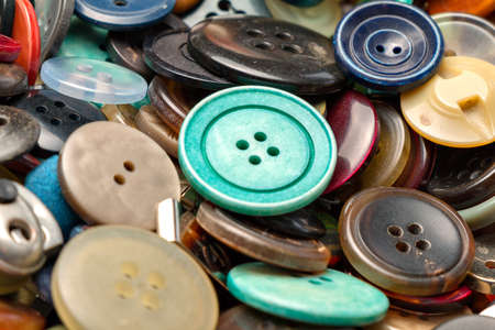 many collected colorful buttons in a boxの写真素材