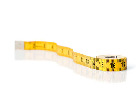 Yellow white tailor tape measure to take measurements and measure