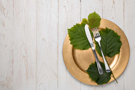 Cutlery is in a napkin wrapped on an old table