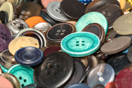 many collected colorful buttons in a boxの写真素材