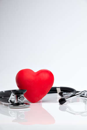Stethoscope with red heart on white backgroundの写真素材