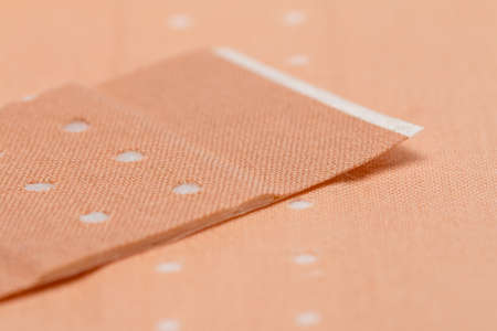 Plaster and bandages with scissors and syringe on white backgroundの写真素材