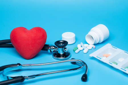 Stethoscope with red heart on blue backgroundの写真素材