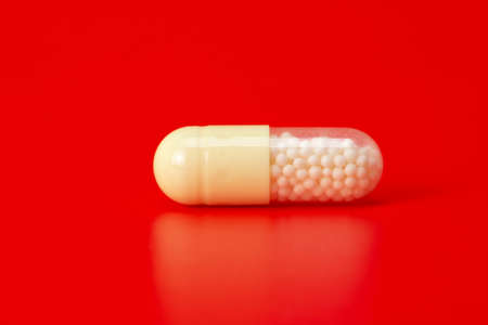 tablets isolated on a red backgroundの写真素材