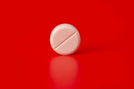 tablets isolated on a red backgroundの写真素材