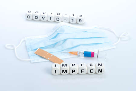 COVID-19, reminder to vaccinate, vaccination card syringe