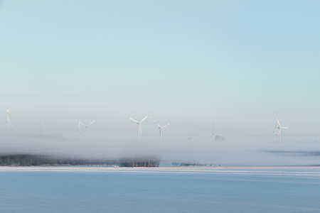 Winter snowy landscape, with blue sky and sunの写真素材