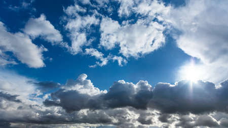 Sunny blue sky with dramatic clouds