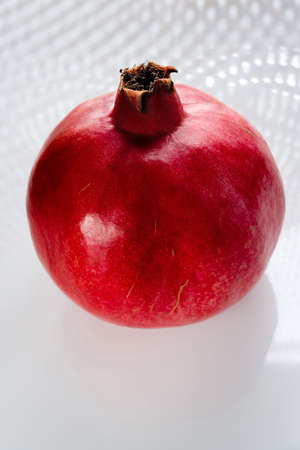 Red pomegranate on white backgroundの写真素材