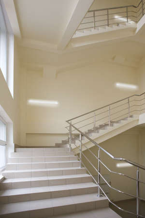 Stairway with metal handrails in the new modern building