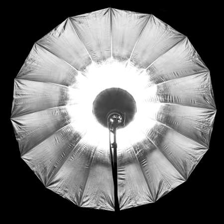 Photographic silver large umbrella brightened right in the frameの写真素材