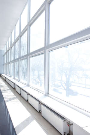 Empty Room with Big White Windows and radiators の写真素材