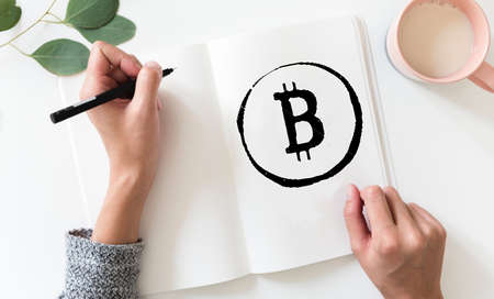 Sketchbook with Bitcoin Logoの写真素材