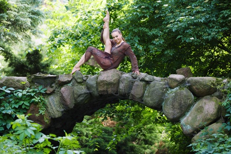 Beautiful gymnast exercise outdoorの写真素材